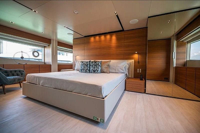 a large bed in a room aboard SK Yacht for Sale