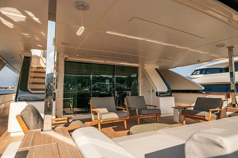 inside of a building with chairs and tables and a large window aboard SK Yacht for Sale