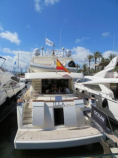 a boat with flags on it aboard ILLA PUERTO PORTALS Yacht for Sale
