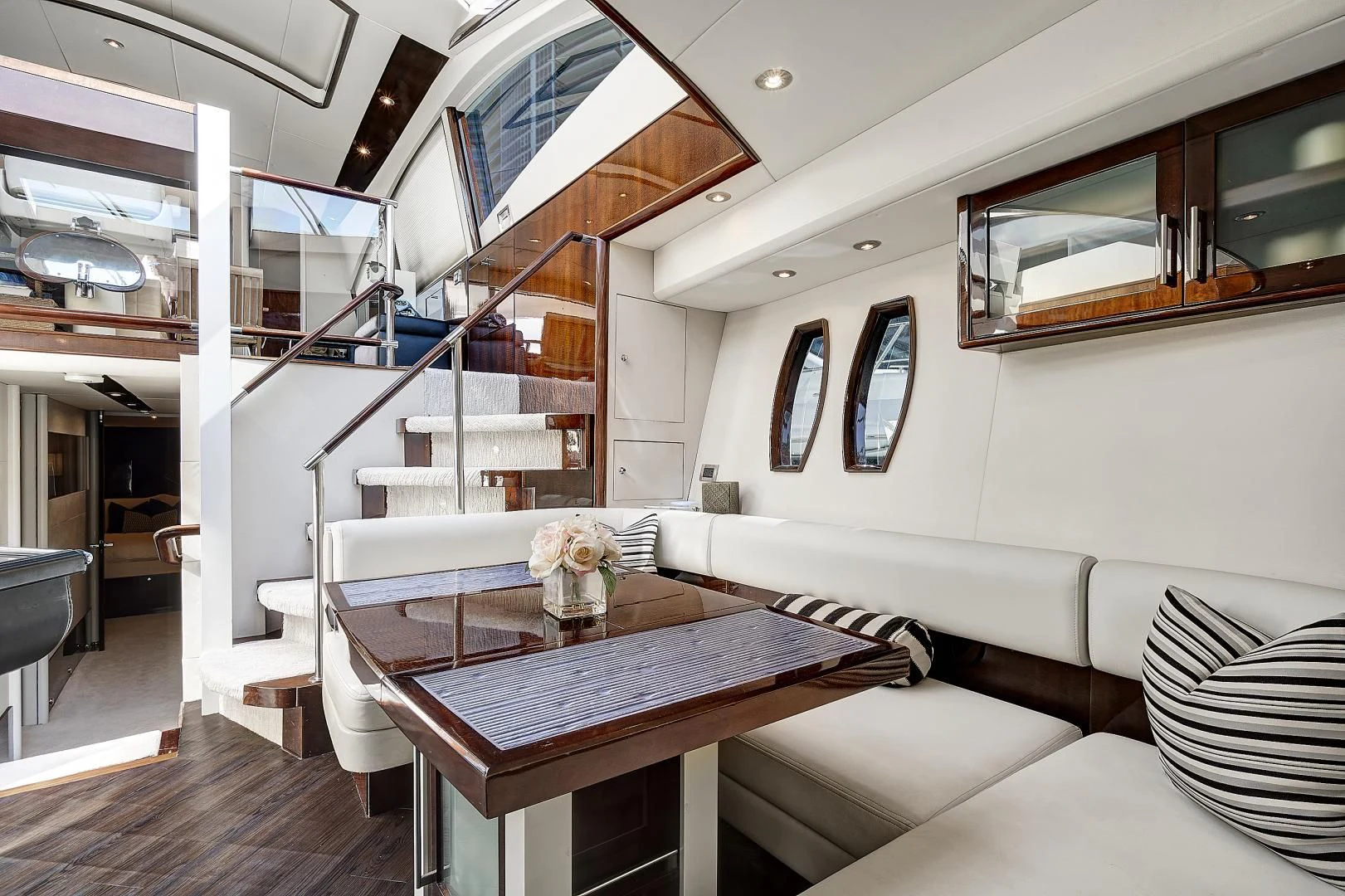 a room with a table and chairs aboard LADY H Yacht for Sale