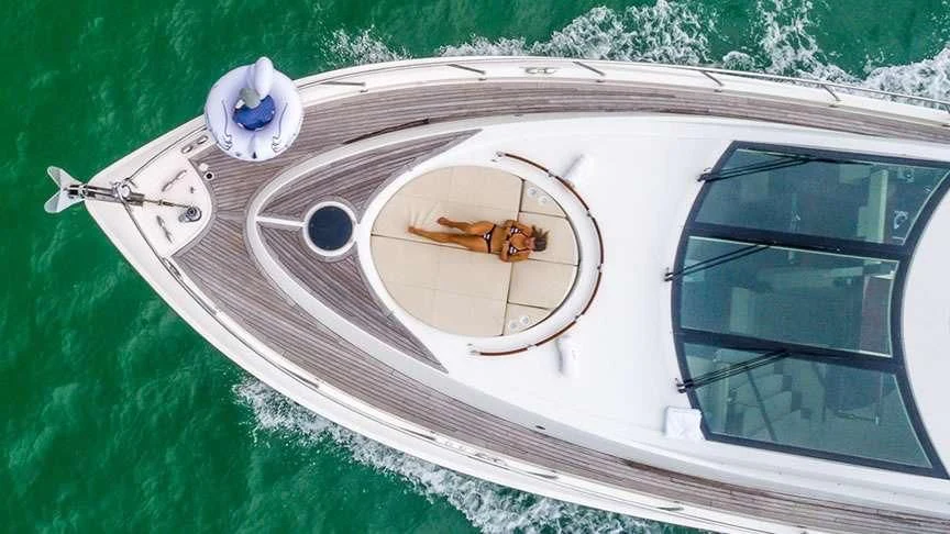 a white car with a round dial and a round dial on the front aboard LADY H Yacht for Sale