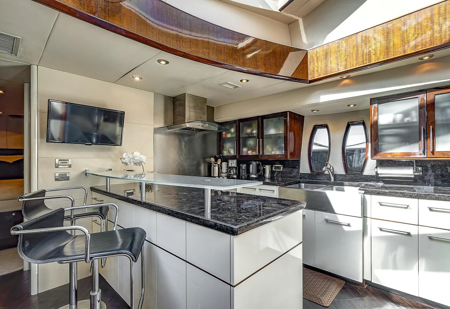 a kitchen with a large island aboard LADY H Yacht for Sale
