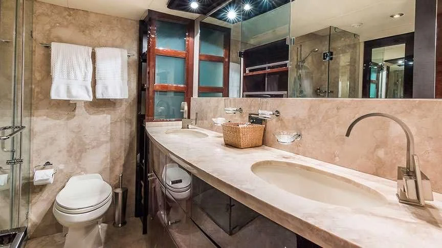 a bathroom with a large mirror aboard LADY H Yacht for Sale