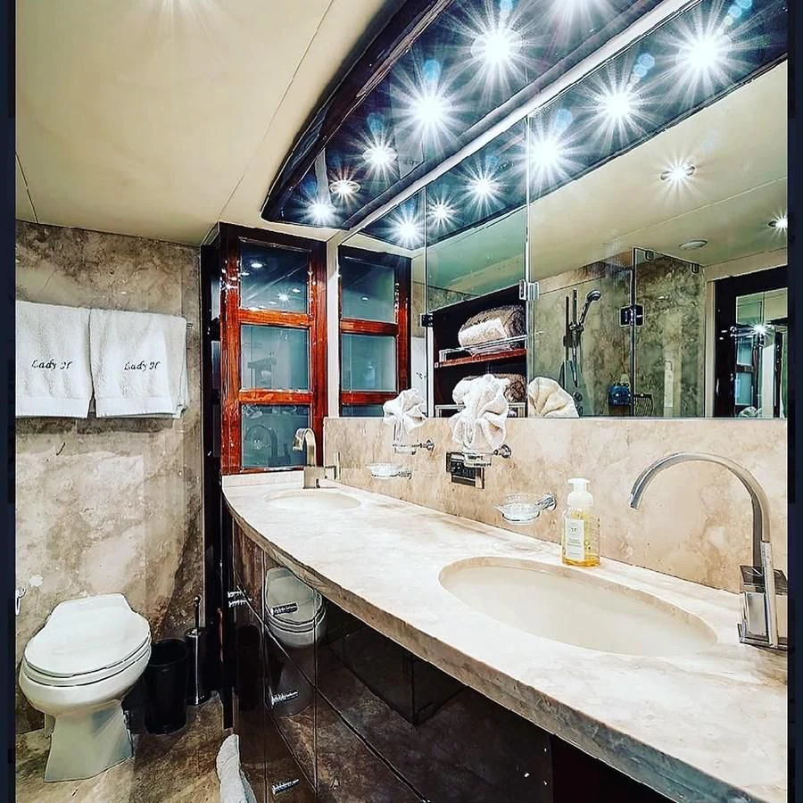 a bathroom with a sink and toilet aboard LADY H Yacht for Sale