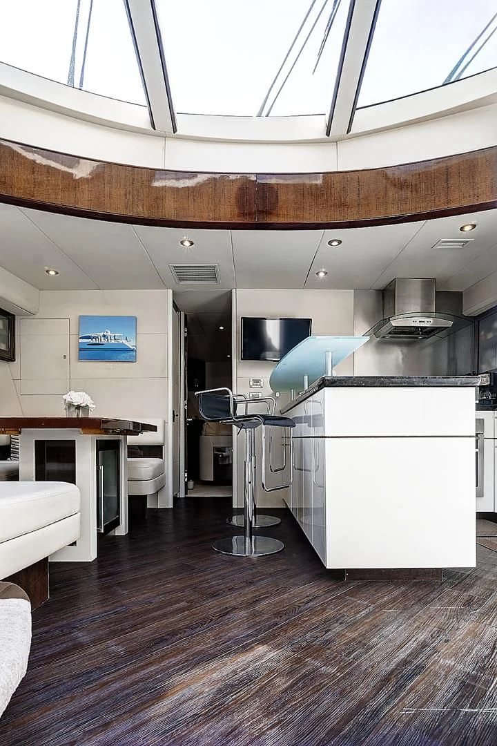 a kitchen with a large island aboard LADY H Yacht for Sale