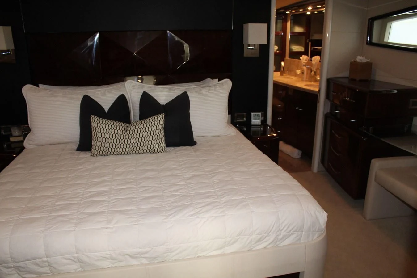 a bed with white sheets aboard LADY H Yacht for Sale