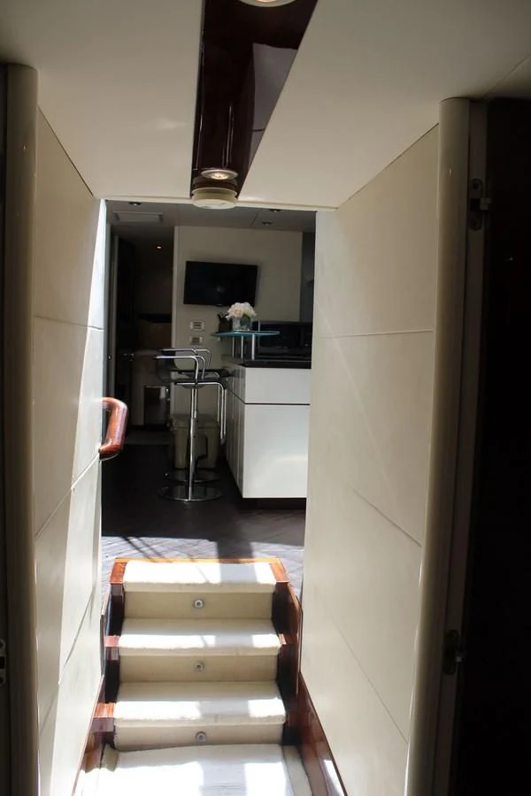 a hallway with a door and a mirror aboard LADY H Yacht for Sale