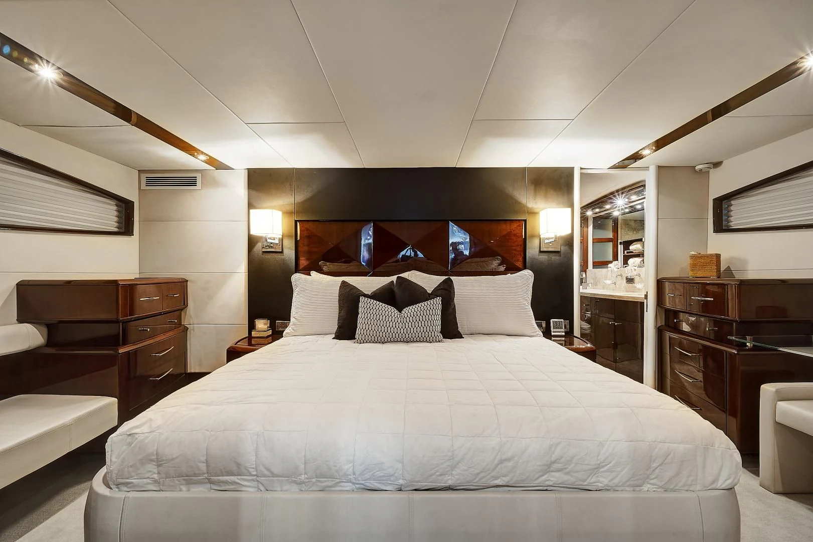 a large bed in a room aboard LADY H Yacht for Sale
