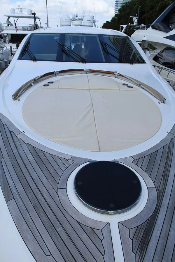 a white boat with a round white circle on it aboard LADY H Yacht for Sale