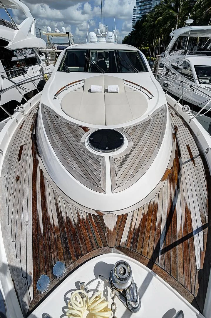 a white car parked on a deck aboard LADY H Yacht for Sale
