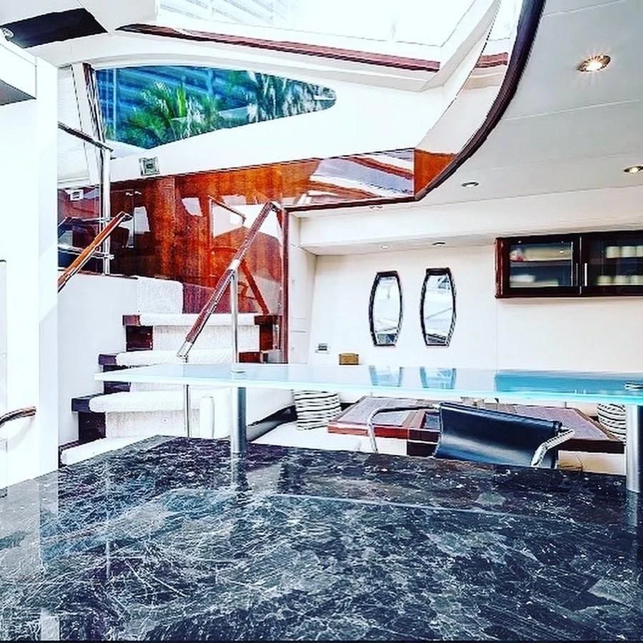 a swimming pool with a glass wall aboard LADY H Yacht for Sale