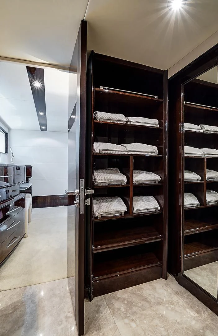 a large closet with a bed aboard LADY H Yacht for Sale