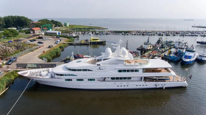 a large white boat sits in the water aboard DANCING HARE Yacht for Sale