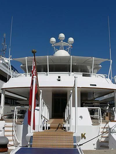 a boat with a flag on the front aboard DANCING HARE Yacht for Sale