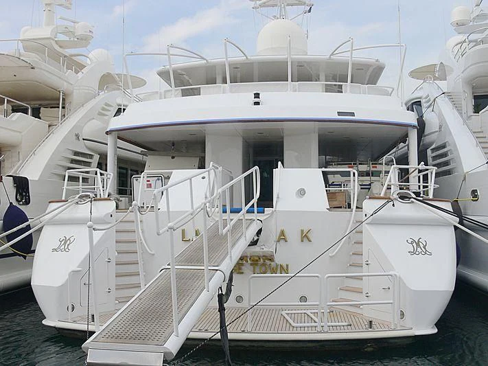 a white boat with a deck aboard DANCING HARE Yacht for Sale