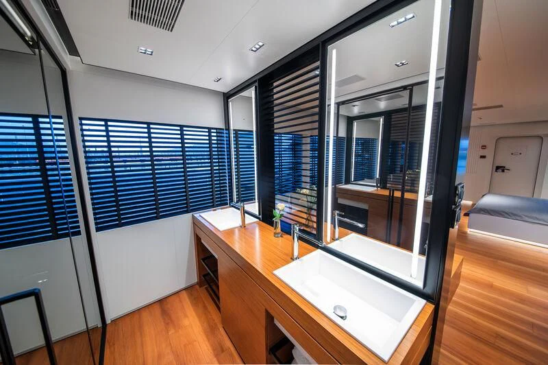 a room with a large glass door aboard SPACECAT Yacht for Sale