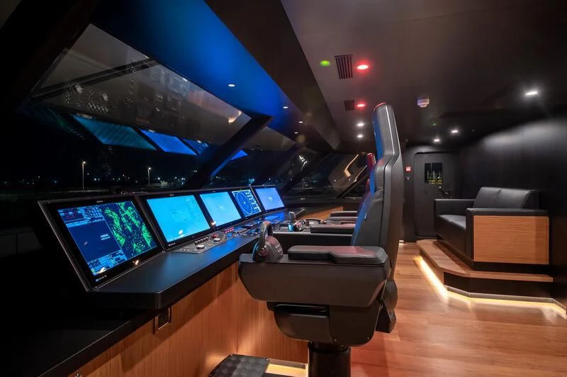 a room with a row of computers aboard SPACECAT Yacht for Sale