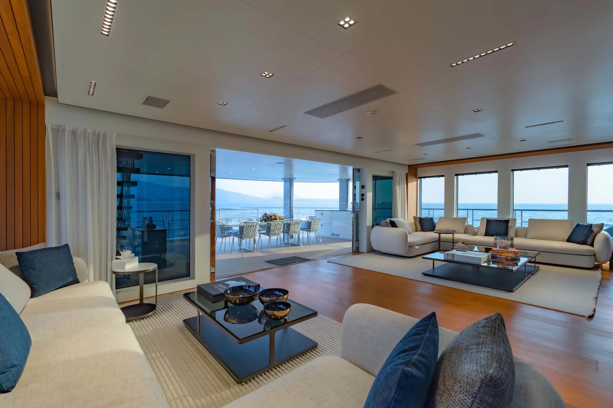 a living room with a large window aboard SPACECAT Yacht for Sale