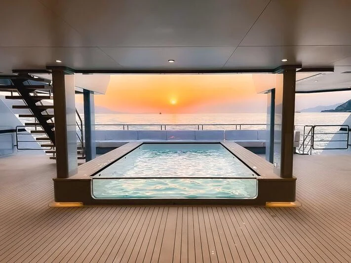 a swimming pool on a deck aboard SPACECAT Yacht for Sale