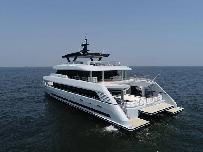 a white yacht in the water aboard SPACECAT Yacht for Sale