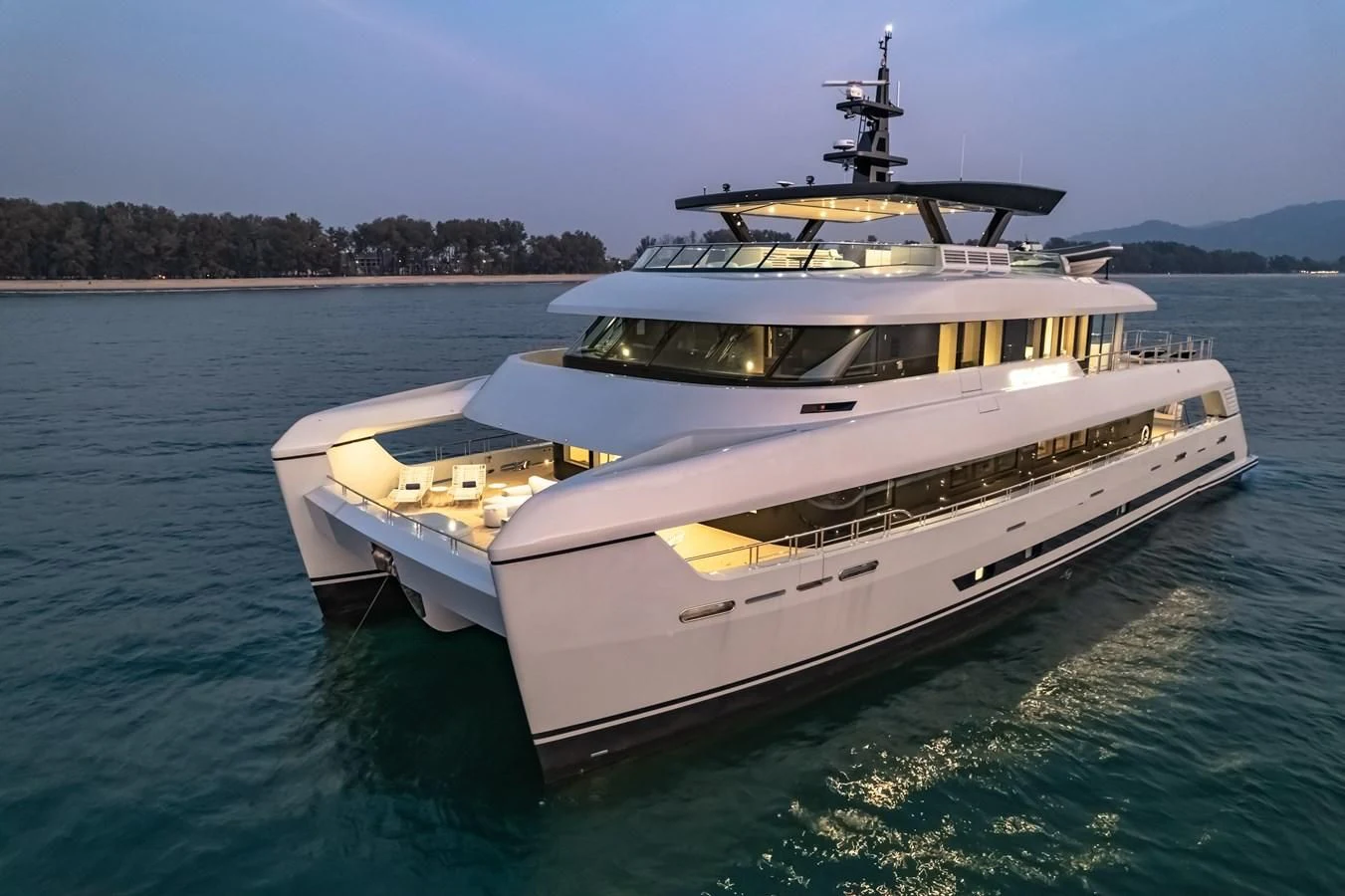 a white yacht on the water aboard SPACECAT Yacht for Sale