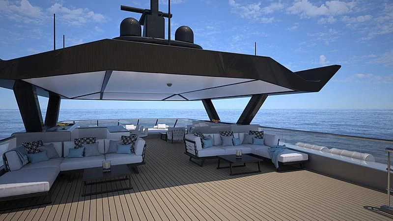 a deck with a large body of water and a large boat in the background aboard SPACECAT Yacht for Sale