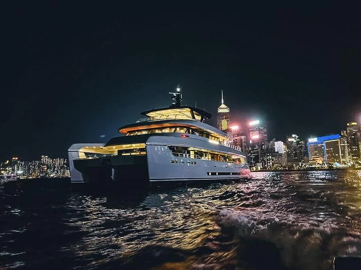 a ferry on the water aboard SPACECAT Yacht for Sale