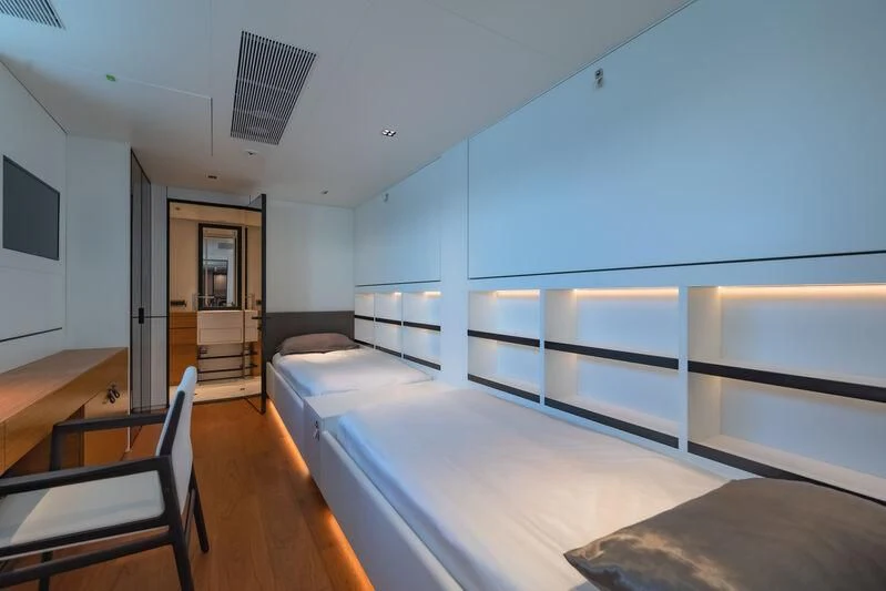 a room with bunk beds aboard SPACECAT Yacht for Sale