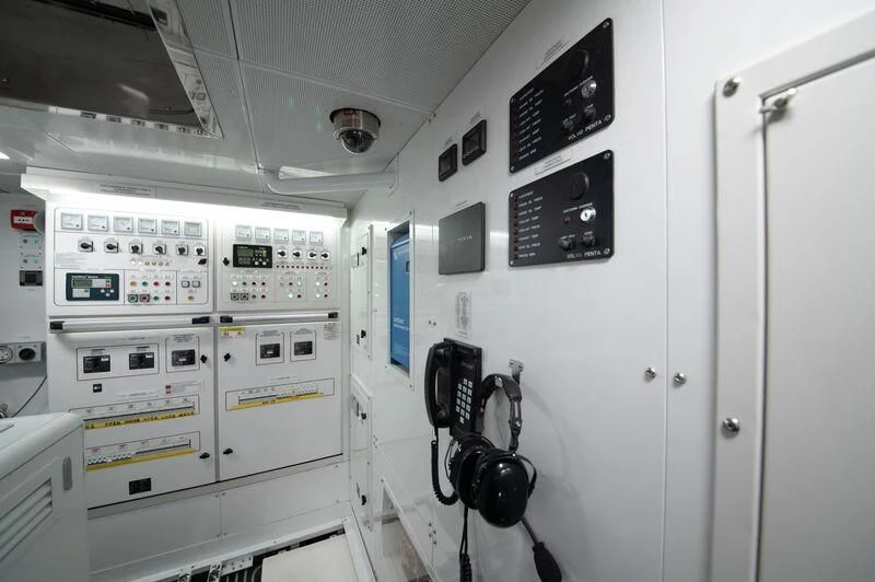 a room with white machines aboard SPACECAT Yacht for Sale