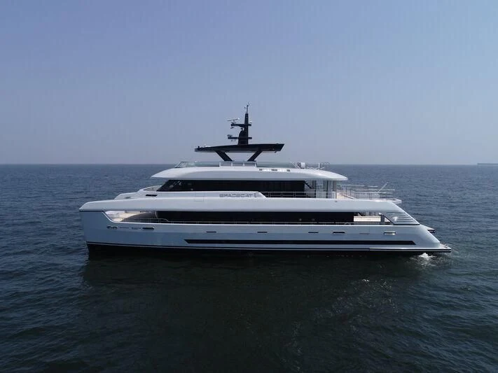 a white yacht in the water aboard SPACECAT Yacht for Sale