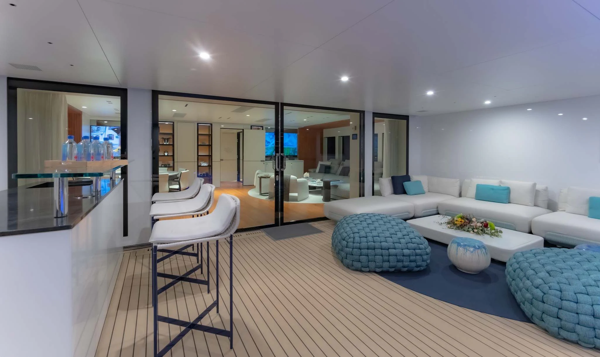 a living room with a large mirror aboard SPACECAT Yacht for Sale