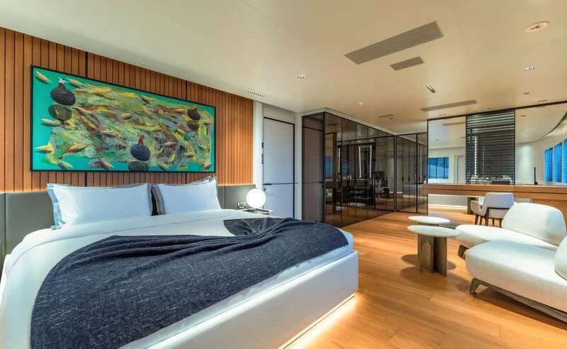 a large bedroom with a large bed aboard SPACECAT Yacht for Sale