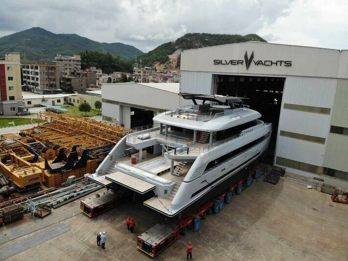 a construction site with a few men aboard SPACECAT Yacht for Sale