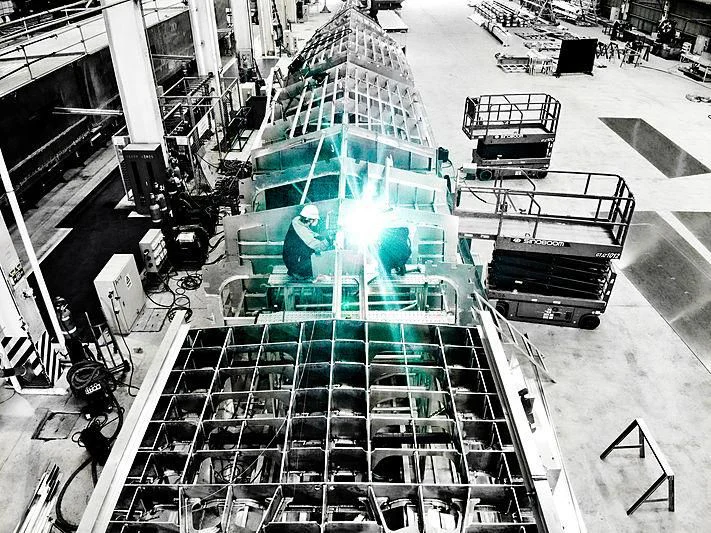 a large factory with machines aboard SPACECAT Yacht for Sale