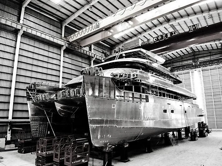 a large machine in a warehouse aboard SPACECAT Yacht for Sale