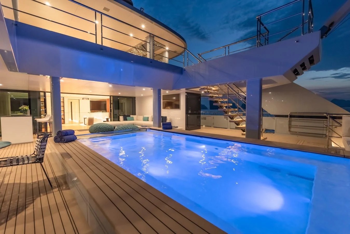 a swimming pool outside a building aboard SPACECAT Yacht for Sale