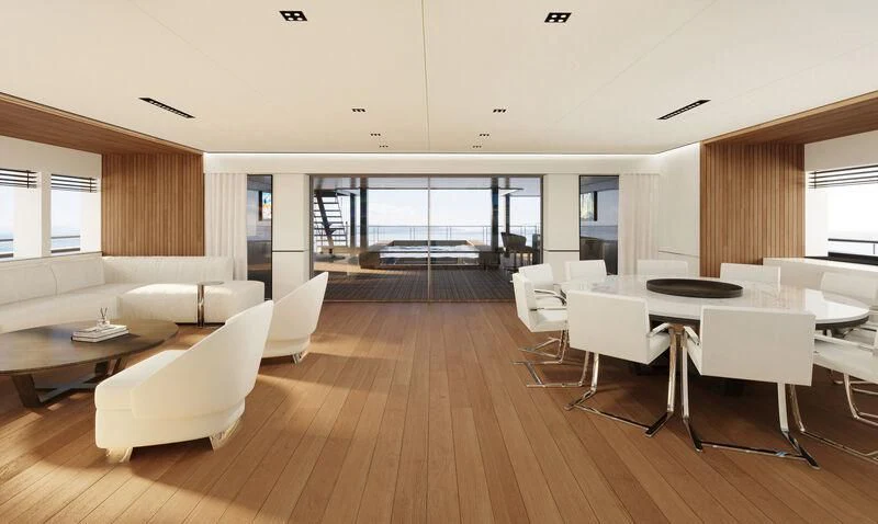 a room with white chairs and a wood floor aboard SPACECAT Yacht for Sale