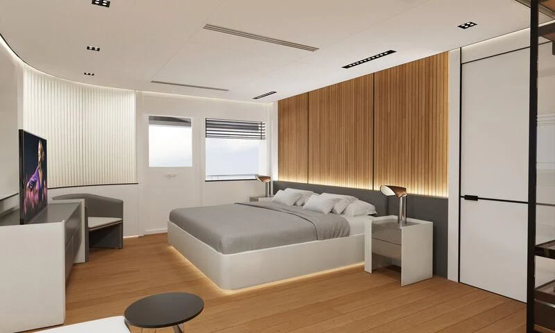 a bedroom with a large bed aboard SPACECAT Yacht for Sale