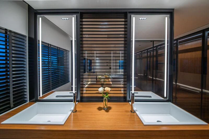 a room with a few glass doors aboard SPACECAT Yacht for Sale