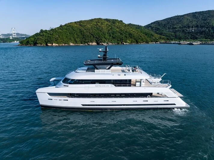 a white yacht in the water aboard SPACECAT Yacht for Sale