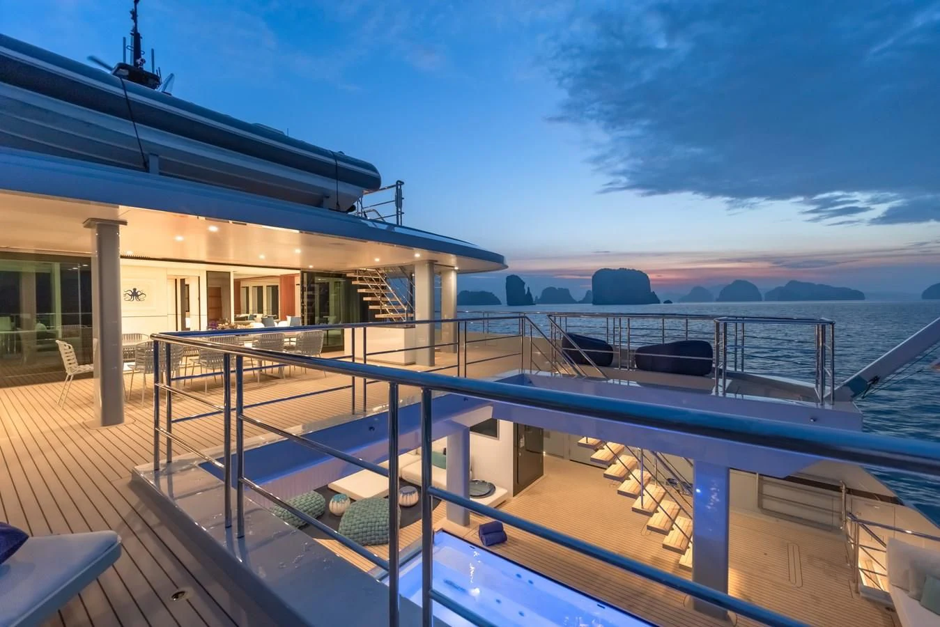 a deck with a deck and a boat on it aboard SPACECAT Yacht for Sale