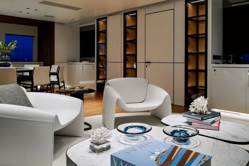 a living room with white furniture aboard SPACECAT Yacht for Sale