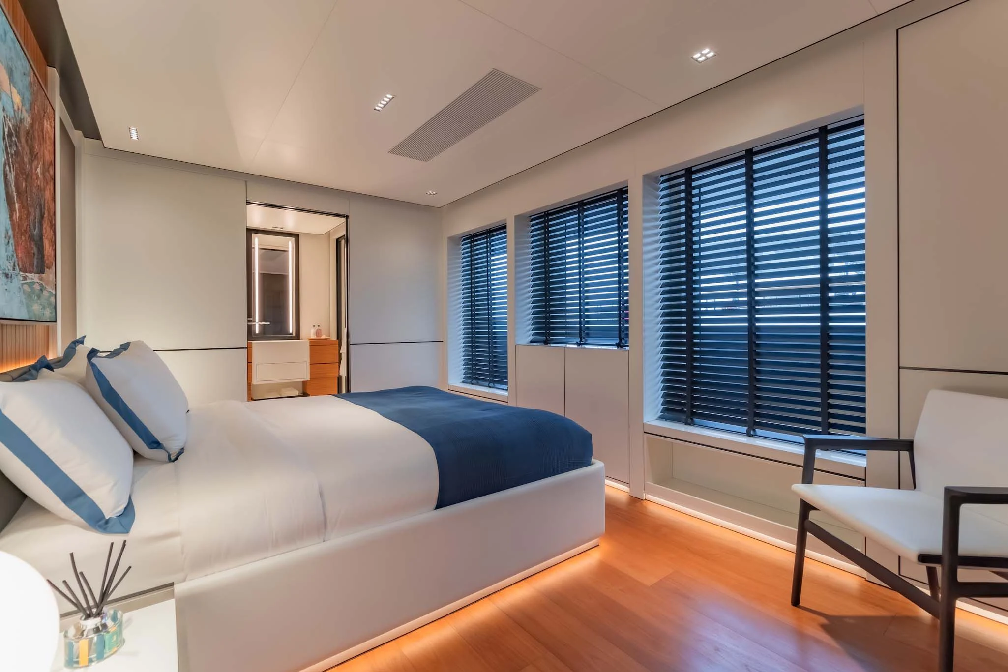 a living room with a couch and a window aboard SPACECAT Yacht for Sale