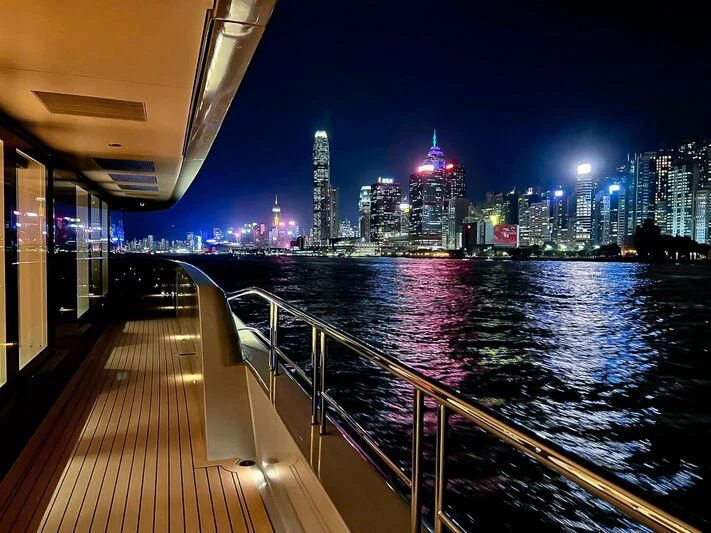 a body of water with a city in the background aboard SPACECAT Yacht for Sale