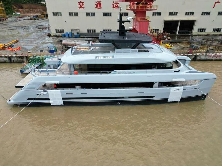 a white and black boat aboard SPACECAT Yacht for Sale