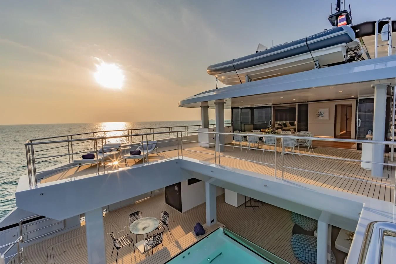 a deck with a deck and a boat on it aboard SPACECAT Yacht for Sale