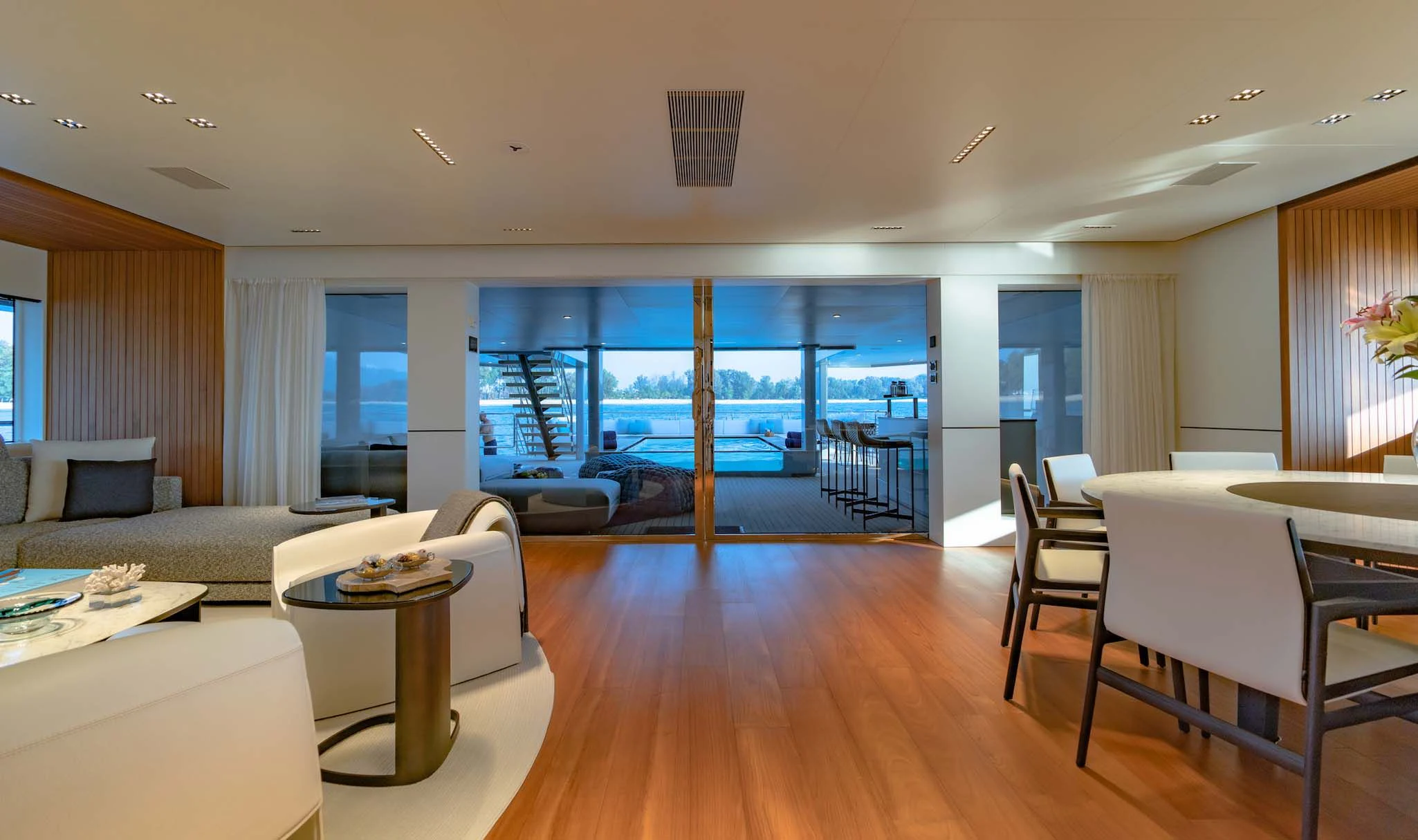 a living room with a large window aboard SPACECAT Yacht for Sale