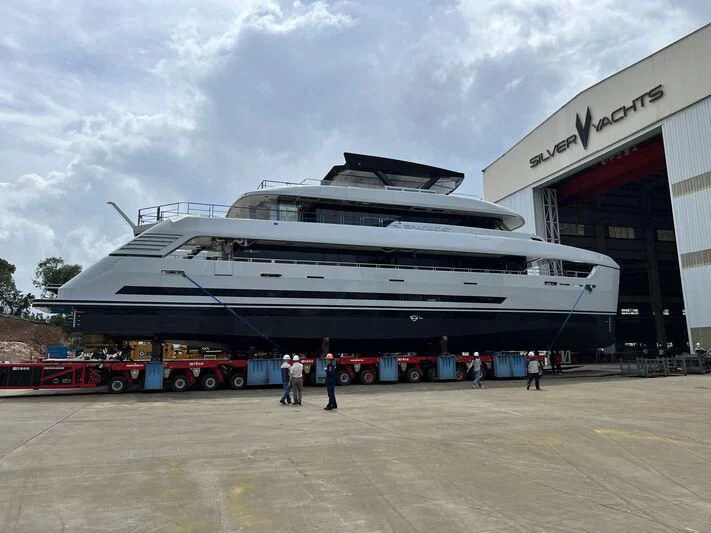 a large cruise ship docked aboard SPACECAT Yacht for Sale