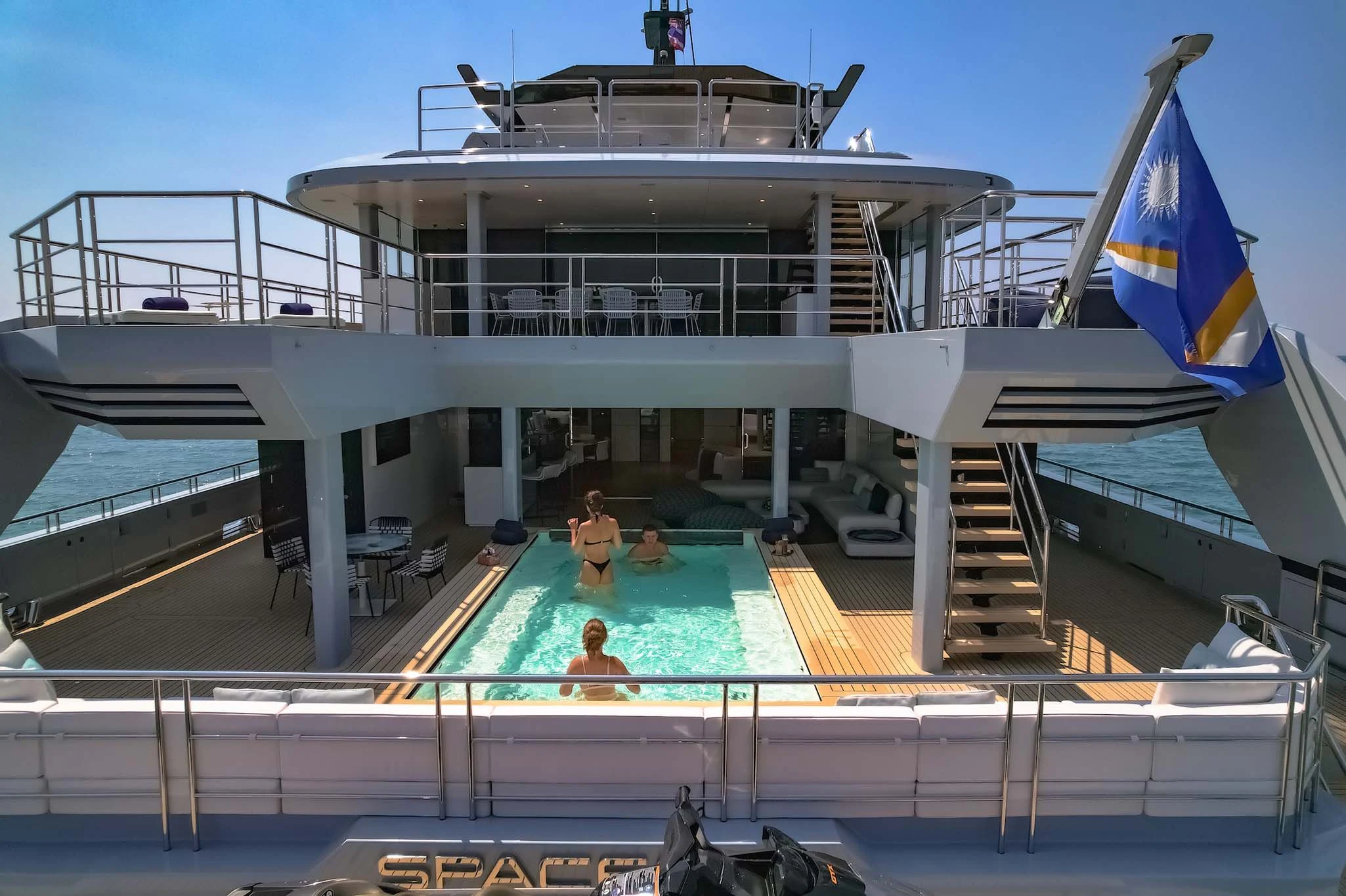 people in a swimming pool aboard SPACECAT Yacht for Sale