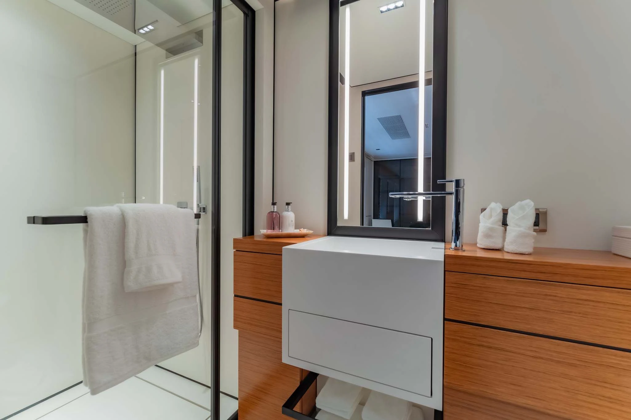 a bathroom with a sink and a mirror aboard SPACECAT Yacht for Sale